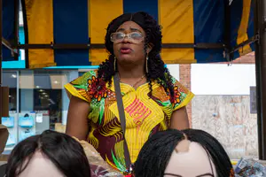 Dudley market had had very few black traders this is Pitshuo is from Congo and her business is RPA fabrics and hair. She has journeyed from Congo to Dudley high street. - 2021-07-31 Do Fest (Edited)-21.jpg